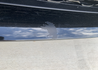 Example of paint blemishes or discoloration found on a used car.